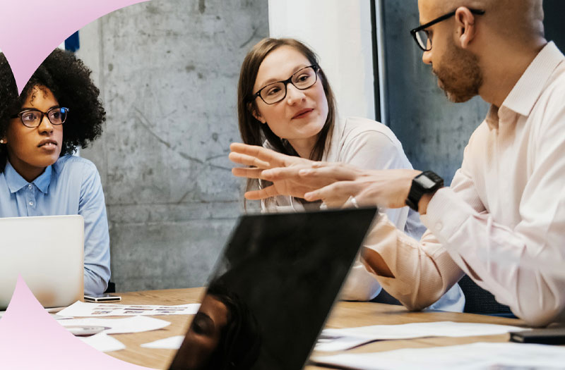 group of people in an office discussing topics