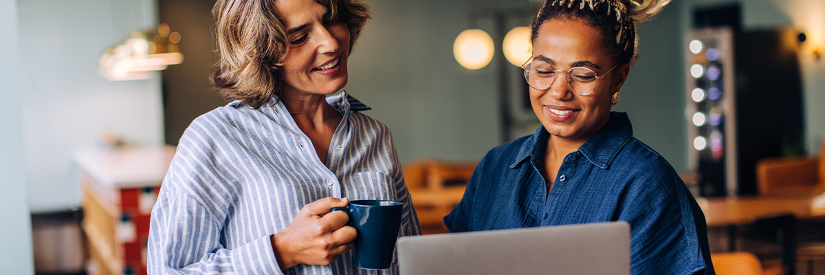 Two colleagues working on a laptop