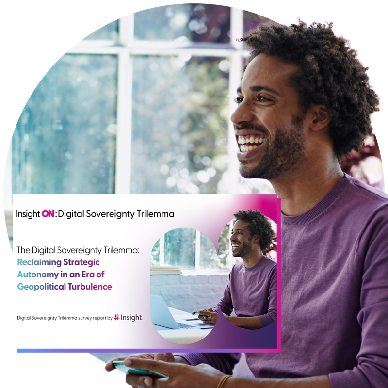 Close up of a smiling man using a laptop