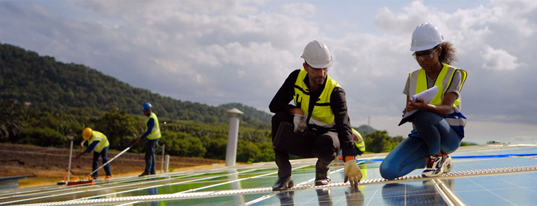 Construction worker on a solar roof