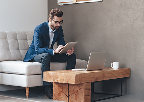 Well dressed male on a tablet