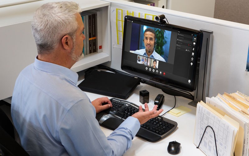 Business man using Poly video call