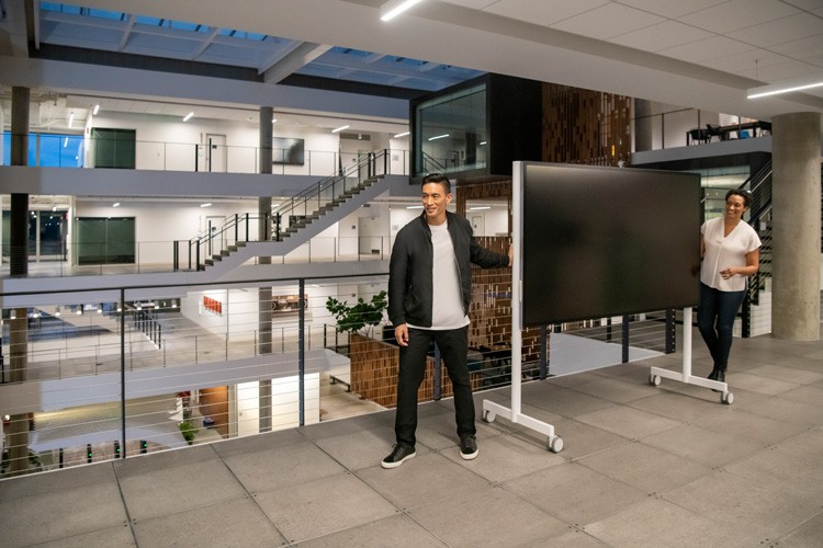 Man and Woman moving Surface Hub 2S 85"